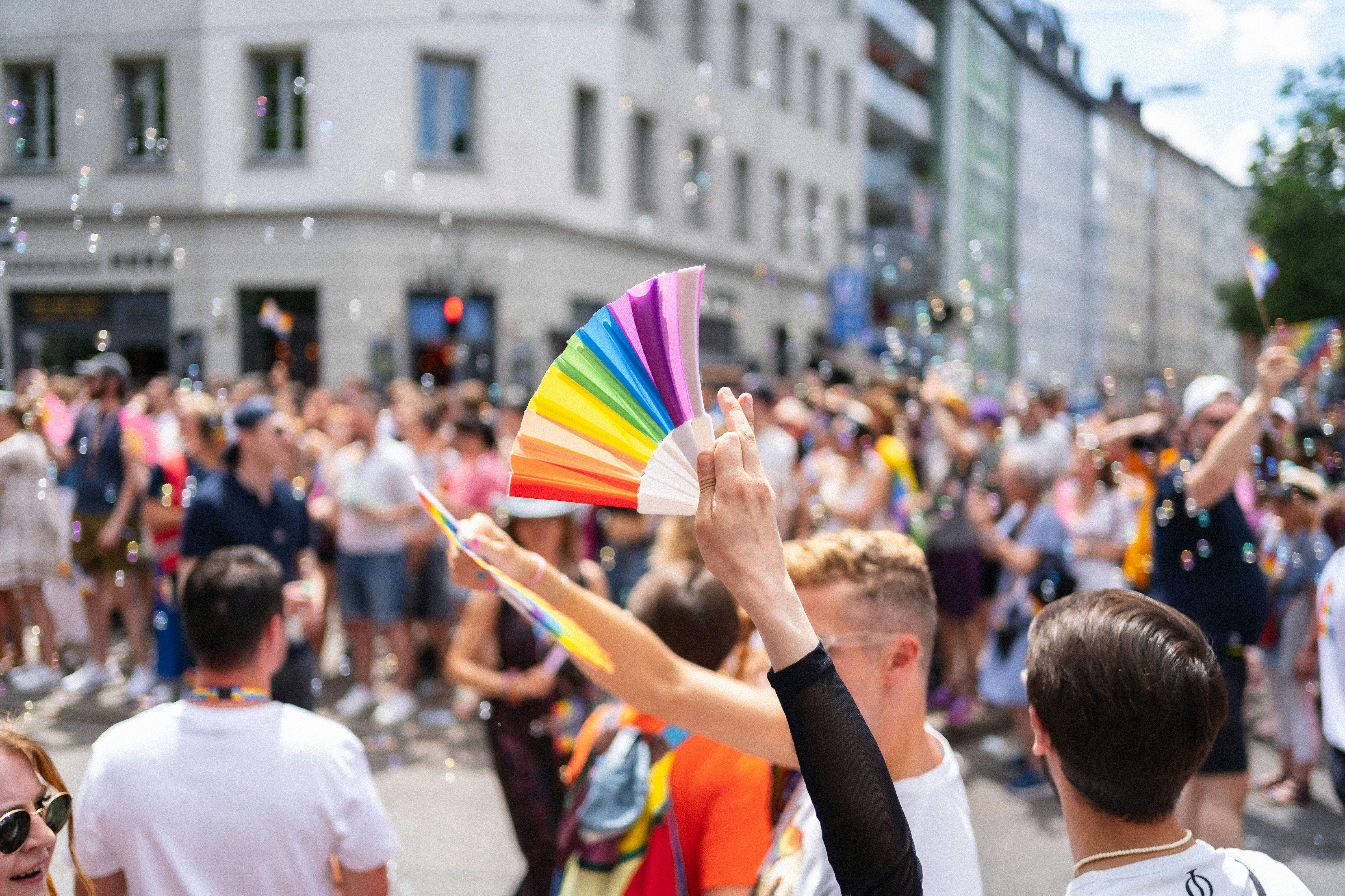 Thousands of people celebrating at a colorful Pride parade