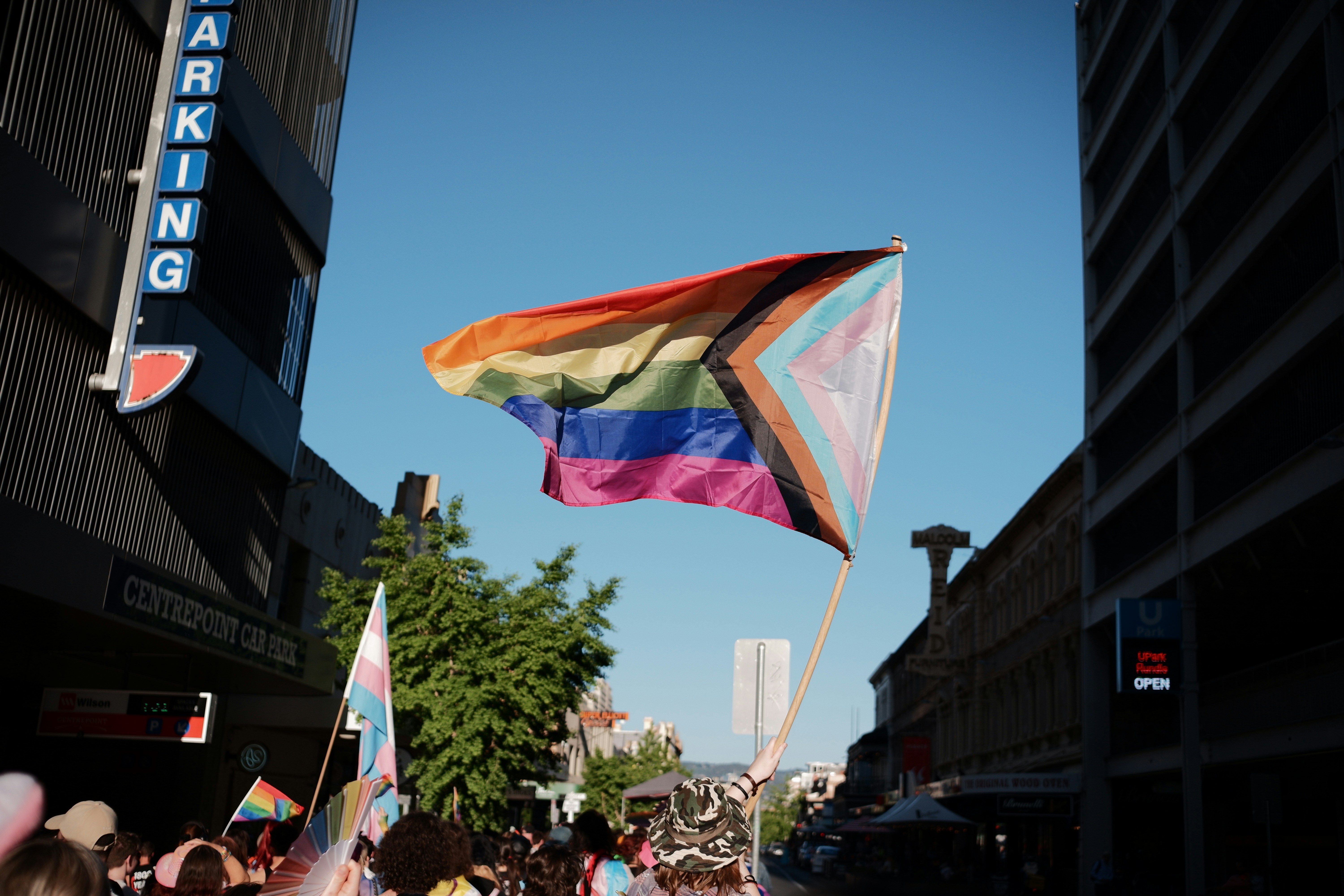 LGBTQ+ community celebrating at a street pride parade